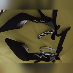 Black pumps. Tie back ribbon. Embellished (fake diamonds) ankle strap. Worn once